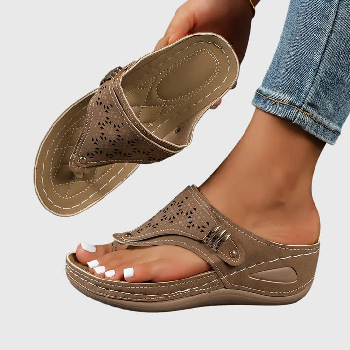 Black women's orthopedic sandals with arch support for comfortable summer walking and foot pain relief.