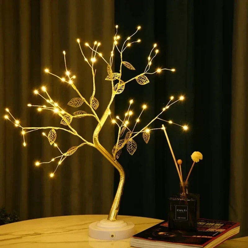 Elegant LED bonsai tree lamp featuring golden leaves and a warm white glow. A beautiful table lamp for ambient lighting.