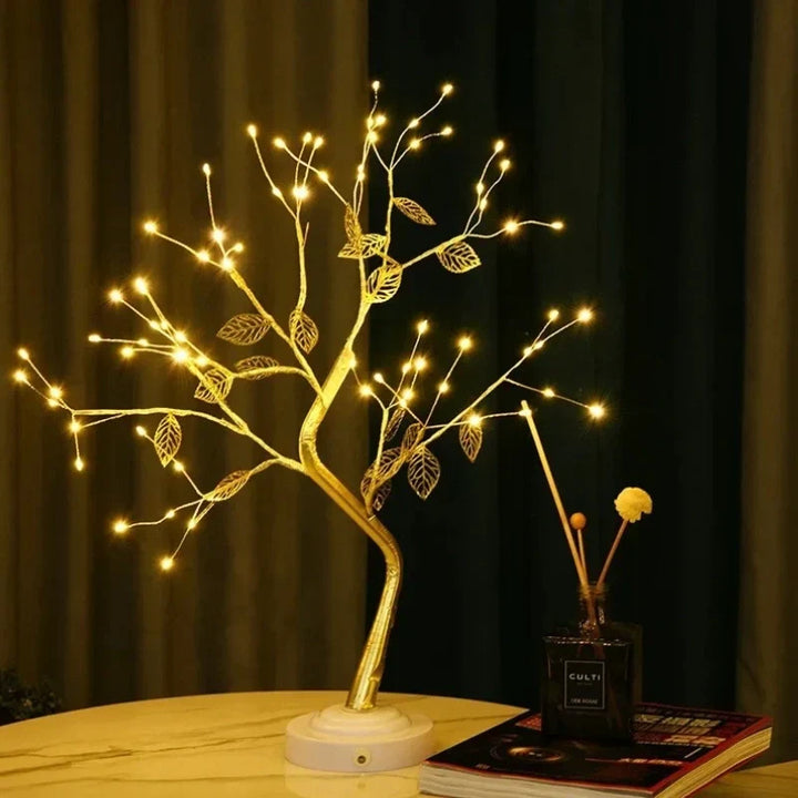 Elegant LED bonsai tree lamp featuring golden leaves and a warm white glow. A beautiful table lamp for ambient lighting.