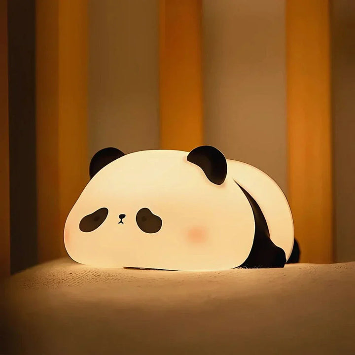 Child-safe silicone animal night light, LED; tap dimming, ideal for nursery & bedside table.