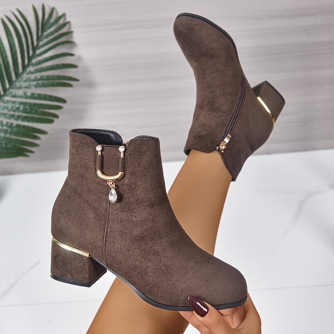 Chic brown women's ankle boots with a comfortable, stable block heel, classic Chelsea style for daily wear.