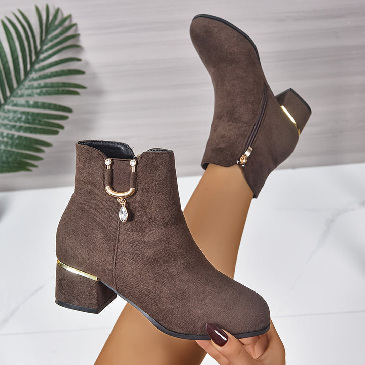 Chic brown women's ankle boots with a comfortable, stable block heel, classic Chelsea style for daily wear.