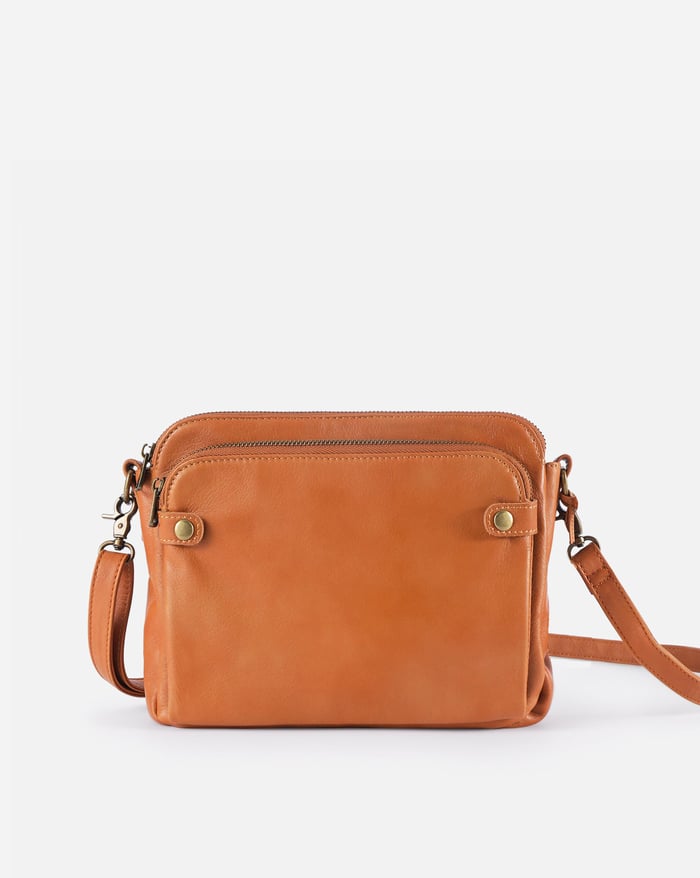 Eco-friendly full-grain leather crossbody bag for women, durable and stylish everyday accessory.
