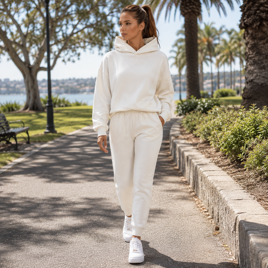 Soft women's hooded jogging set with cozy sweatshirt and comfy joggers, perfect for casual outings.