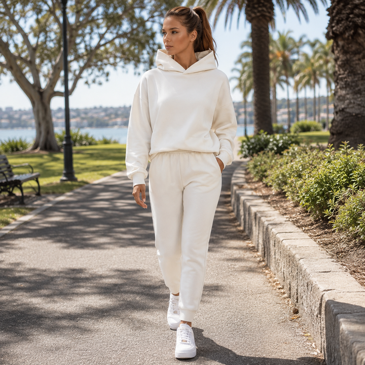 Soft women's hooded jogging set with cozy sweatshirt and comfy joggers, perfect for casual outings.