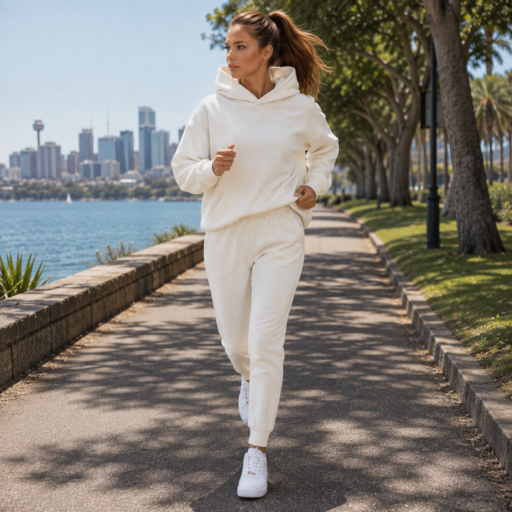 Stylish women's athleisure two-piece set: hooded sweatshirt and matching joggers for casual wear.