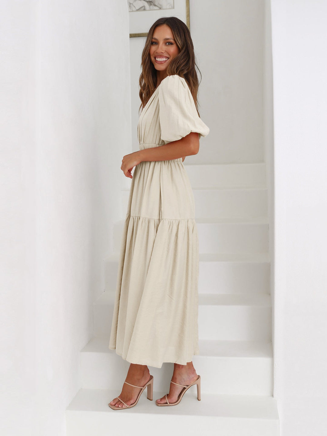 Classic women's puff sleeve midi dress, embodying versatile and timeless elegant fashion.
