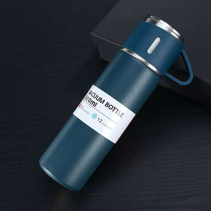 Enjoying hot coffee from the 12-hour thermos flask with its convenient cup lid.