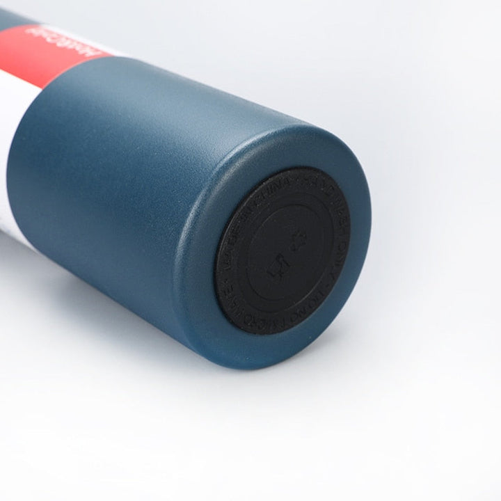 Outdoor gear: Rugged 12-hour insulated thermos flask with secure cup lid.