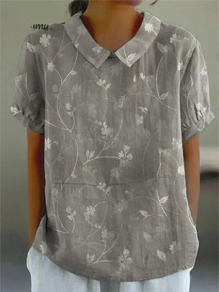 Chic women's short sleeve casual shirt, comfortable relaxed fit, breathable for versatile everyday summer style.