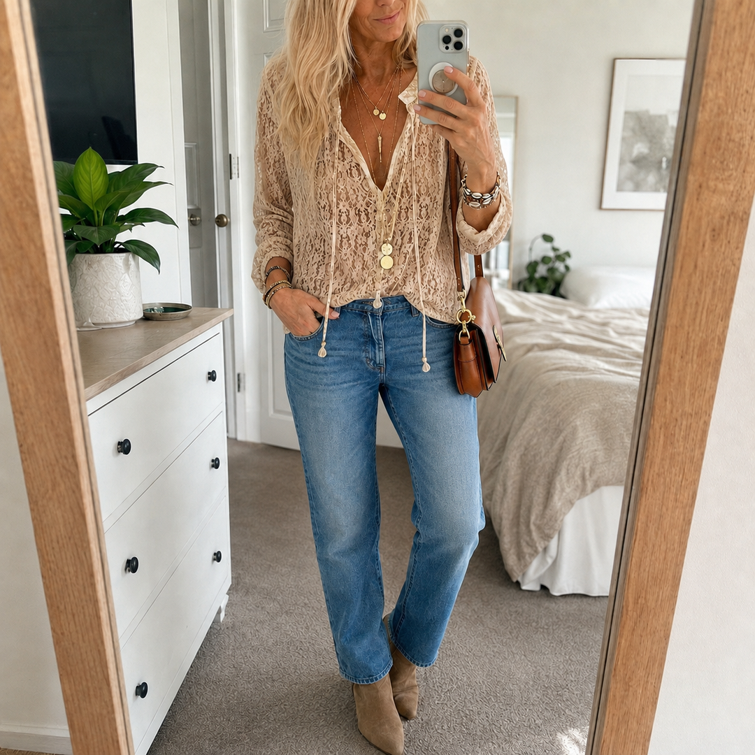 Chic women's boho blouse with delicate lace & v-neck, relaxed fit for feminine style.
