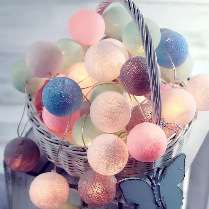 String lights with soft glow cotton balls, perfect for creating a relaxing bedroom ambiance.
