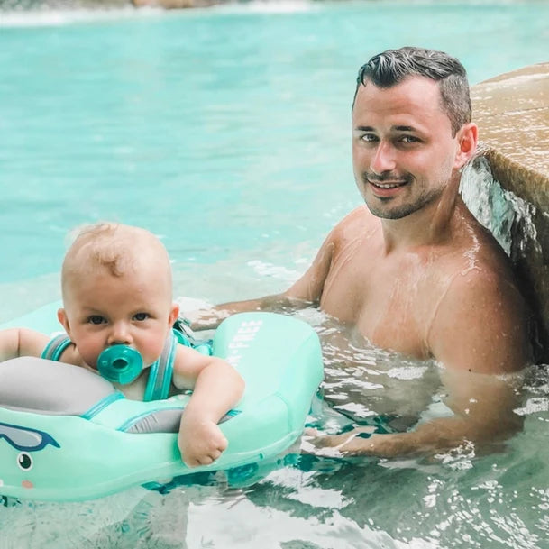 Infant & toddler turquoise swim trainer. Child flotation device for pool fun, building swim confidence.