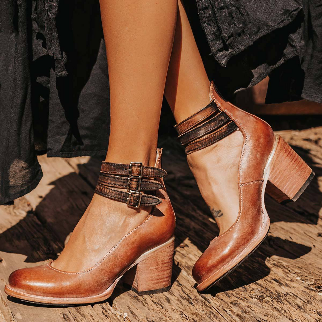 Supportive women's orthopedic ankle boots with strappy details, round toe, and a stable block heel.