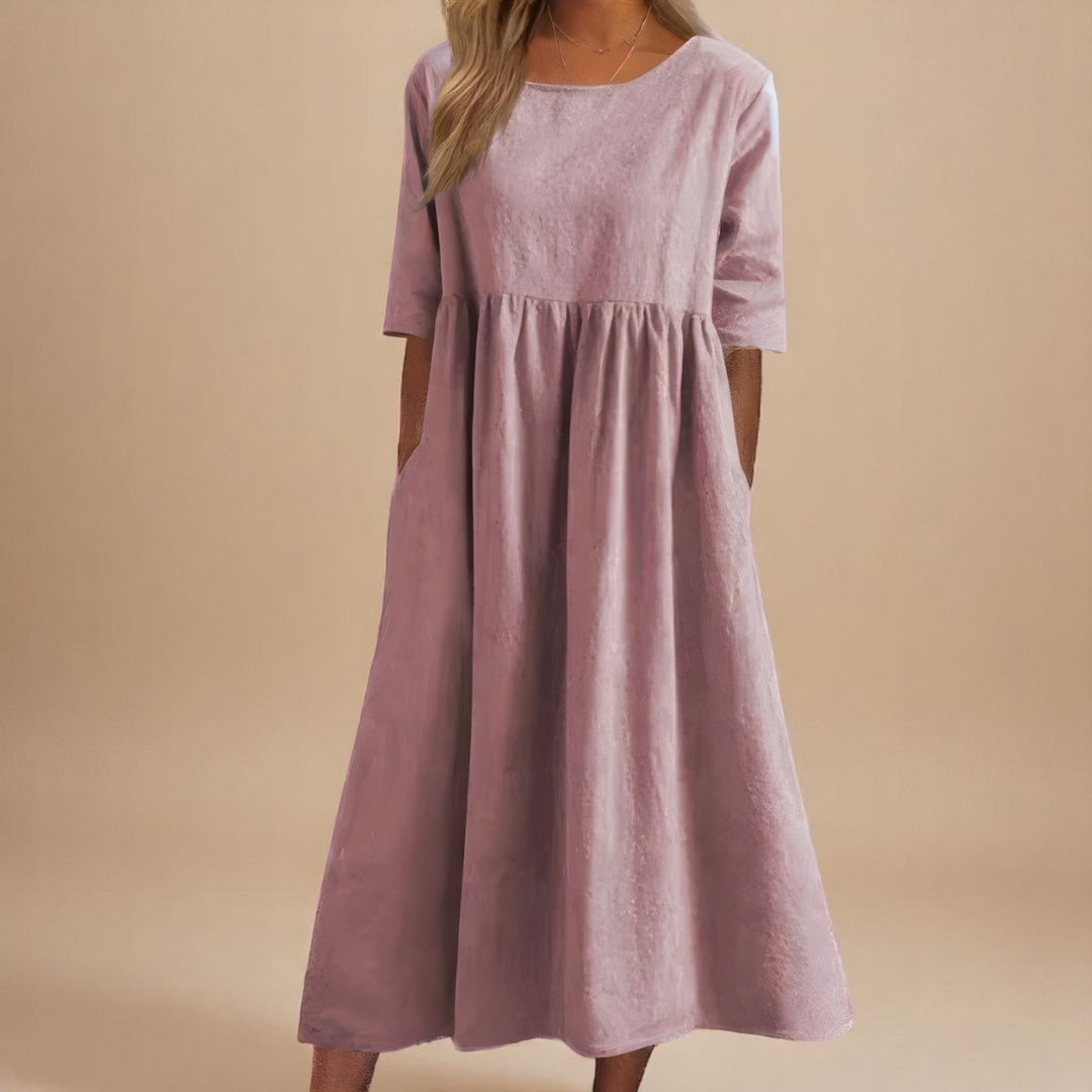 Everyday women's mid-sleeve dress, round neck, with pockets. A comfortable and stylish spring/summer essential.