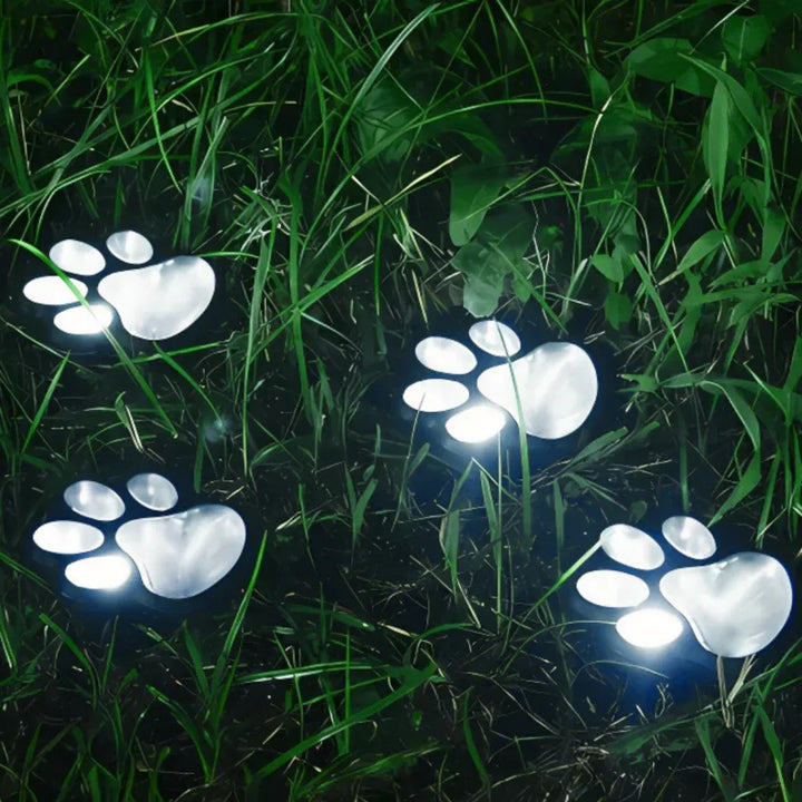 Automatic paw print solar path lights with warm white LED, waterproof outdoor landscape lighting.