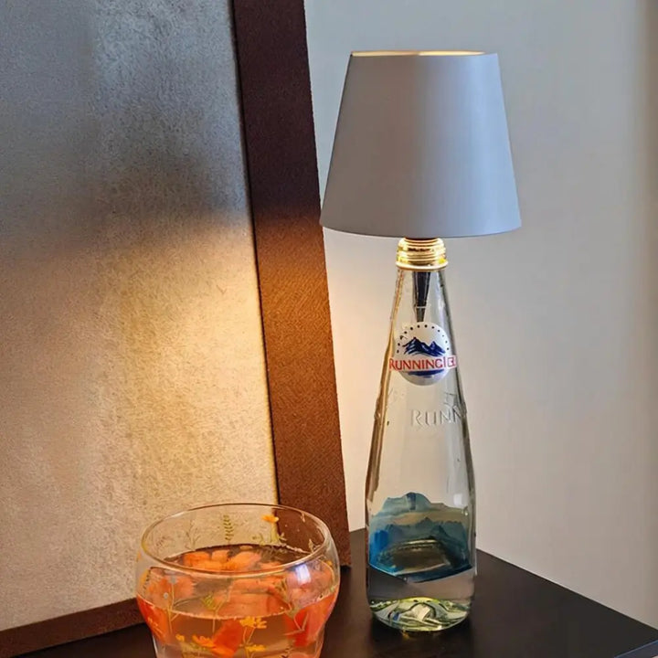Compact LED bottle lamp cap, rechargeable and cordless, perfect for accent lighting & home decor.