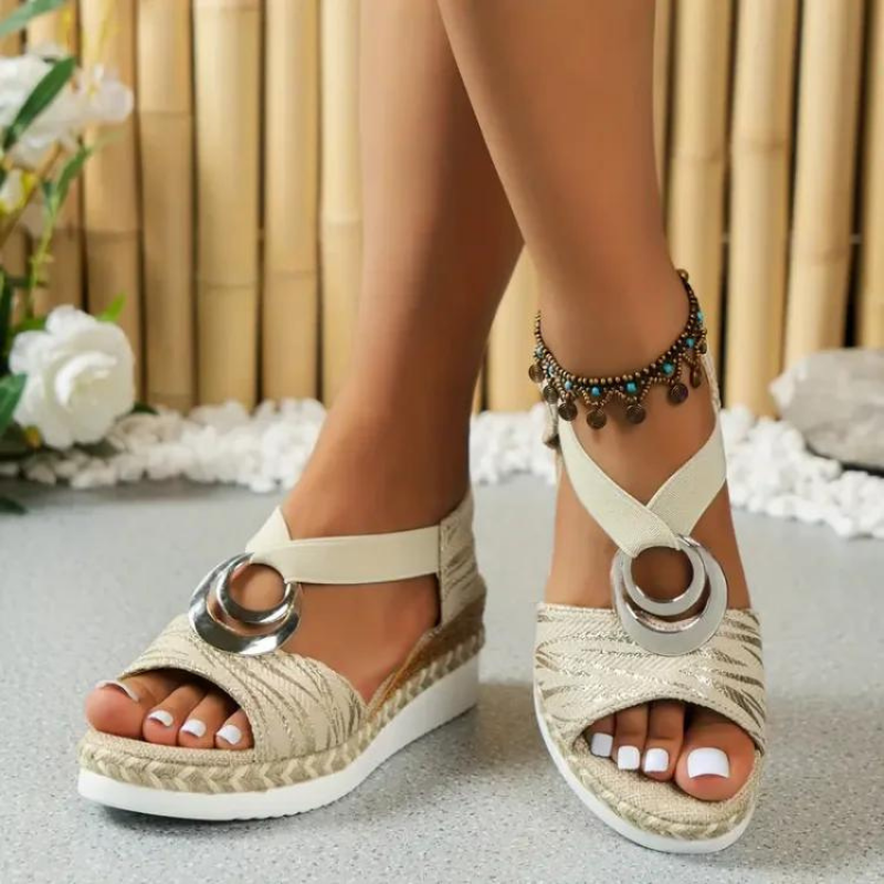 Stylish women's open-toe sandals, showcasing comfortable straps & quality material. Versatile summer footwear.