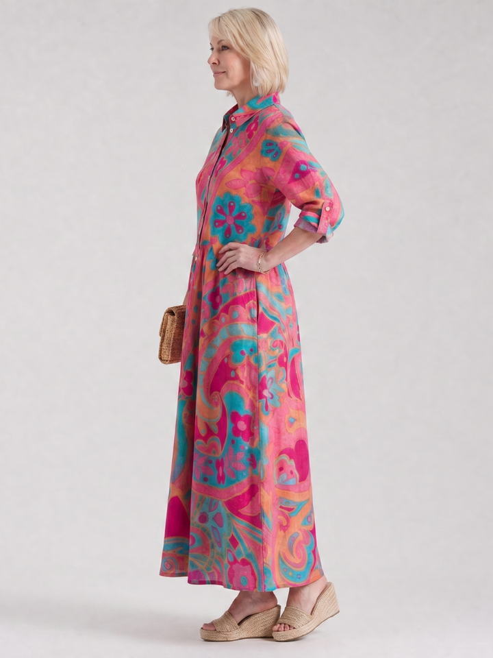 Flowing women's printed midi dress, relaxed fit, collared, and button-front. Ideal for versatile everyday summer fashion.