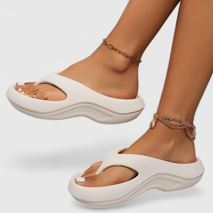 Slip-on women's comfort slides, featuring a lightweight design for easy, casual everyday wear.