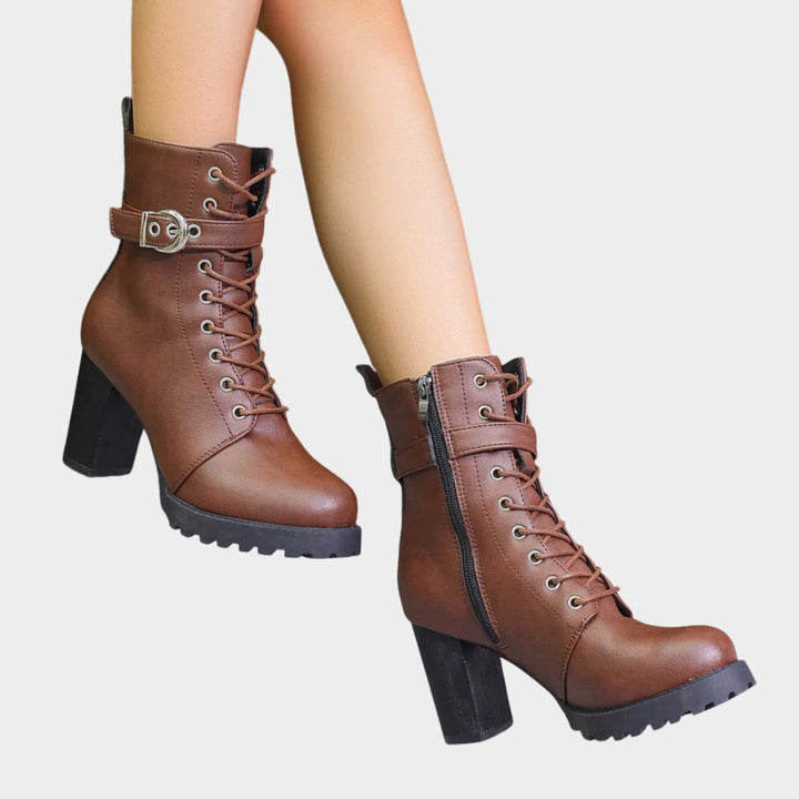 Women's lace-up block heel ankle boots. Combat style for an edgy, fashion-forward look.