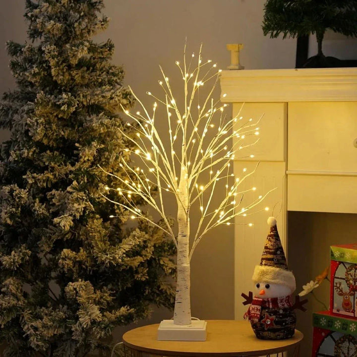 Modern Nordic birch tree light with warm white LEDs, an elegant decorative accent for contemporary homes.