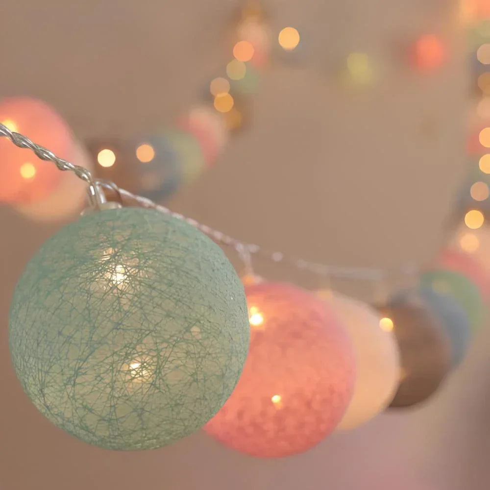 Elegant cotton ball string lights, offering soft illumination for cozy home decor.