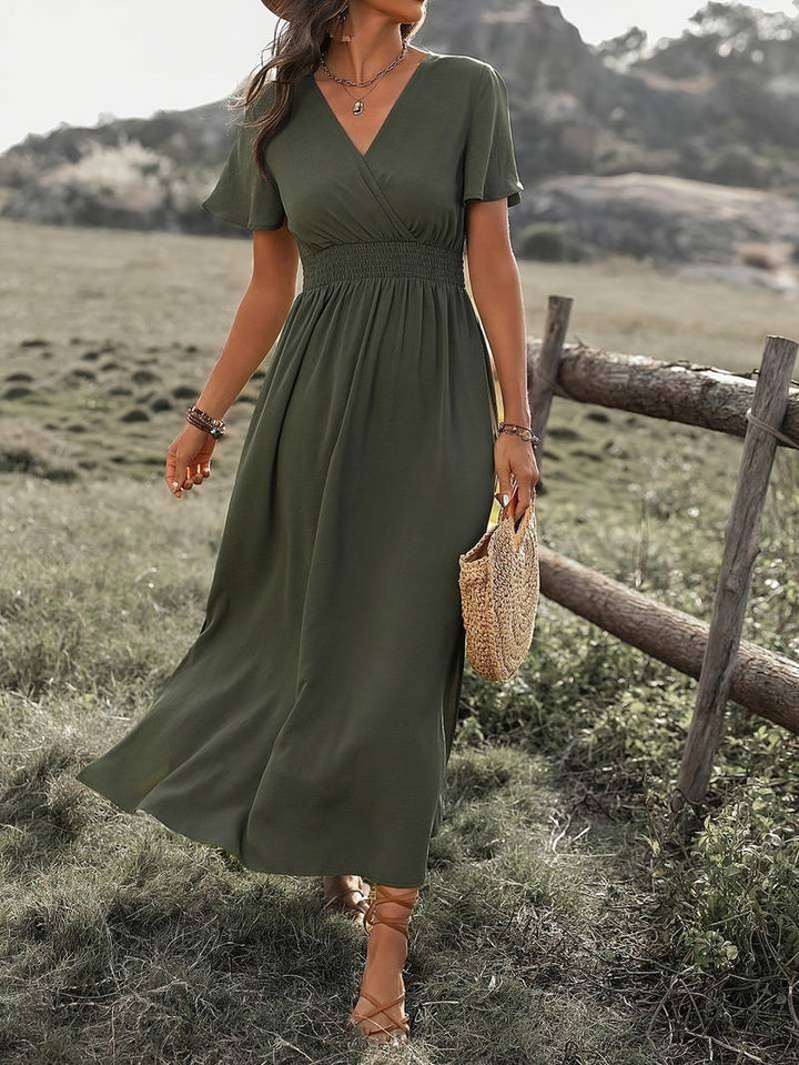 Elegant women's olive green long V-neck maxi dress. A versatile boho flowy dress for summer fashion.