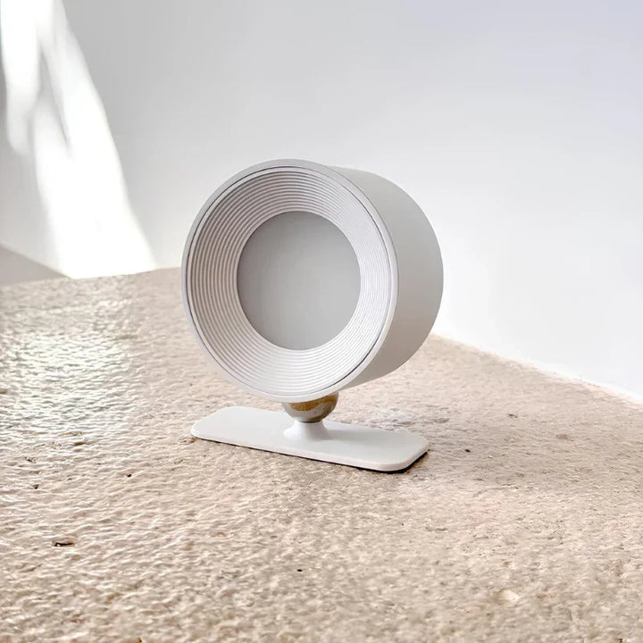 Cordless LED wall lamp by Nvroome, rotatable head, adjustable brightness for home lighting.