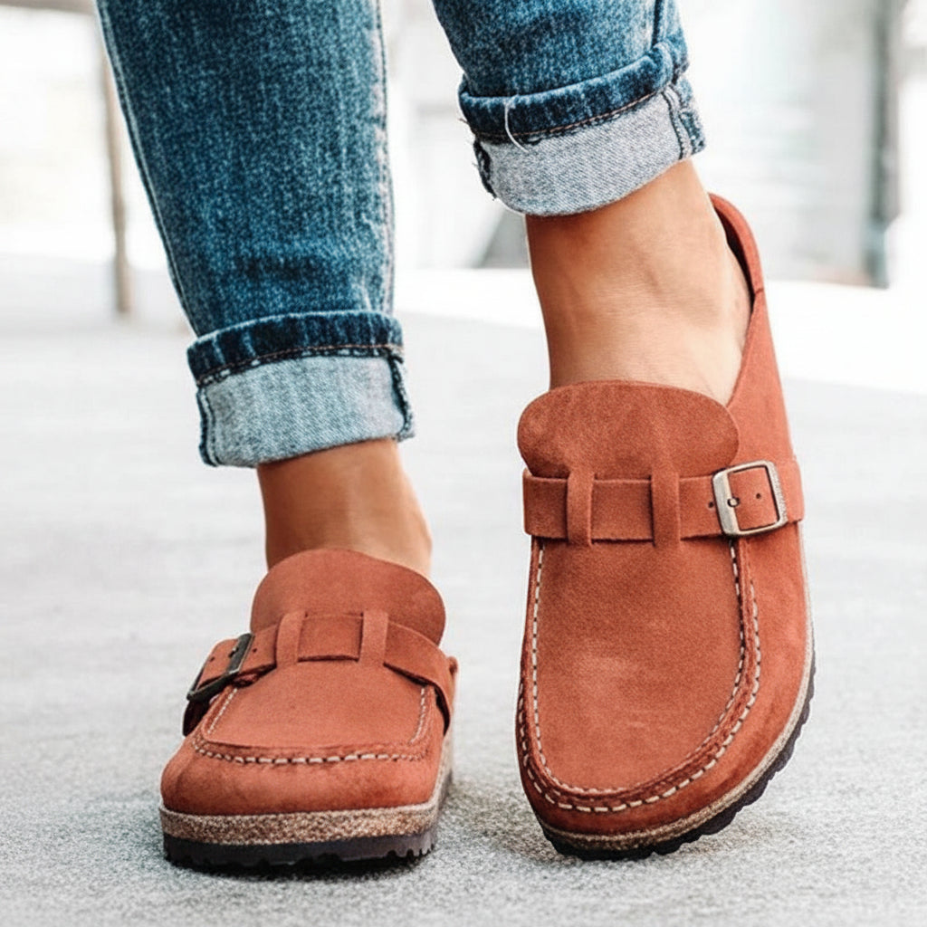 Women's sleek buckle slip-on slippers with a supportive comfort foam sole, great for all-day wear.