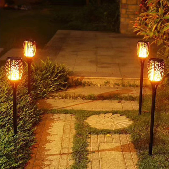 Solar-powered LED torch light with realistic flickering flame, perfect for garden & yard pathway ambiance.