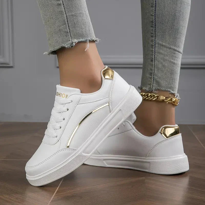 Women's elegant low-cut sneakers in silver gray with chic gold accents. Stylish & comfortable for daily wear.