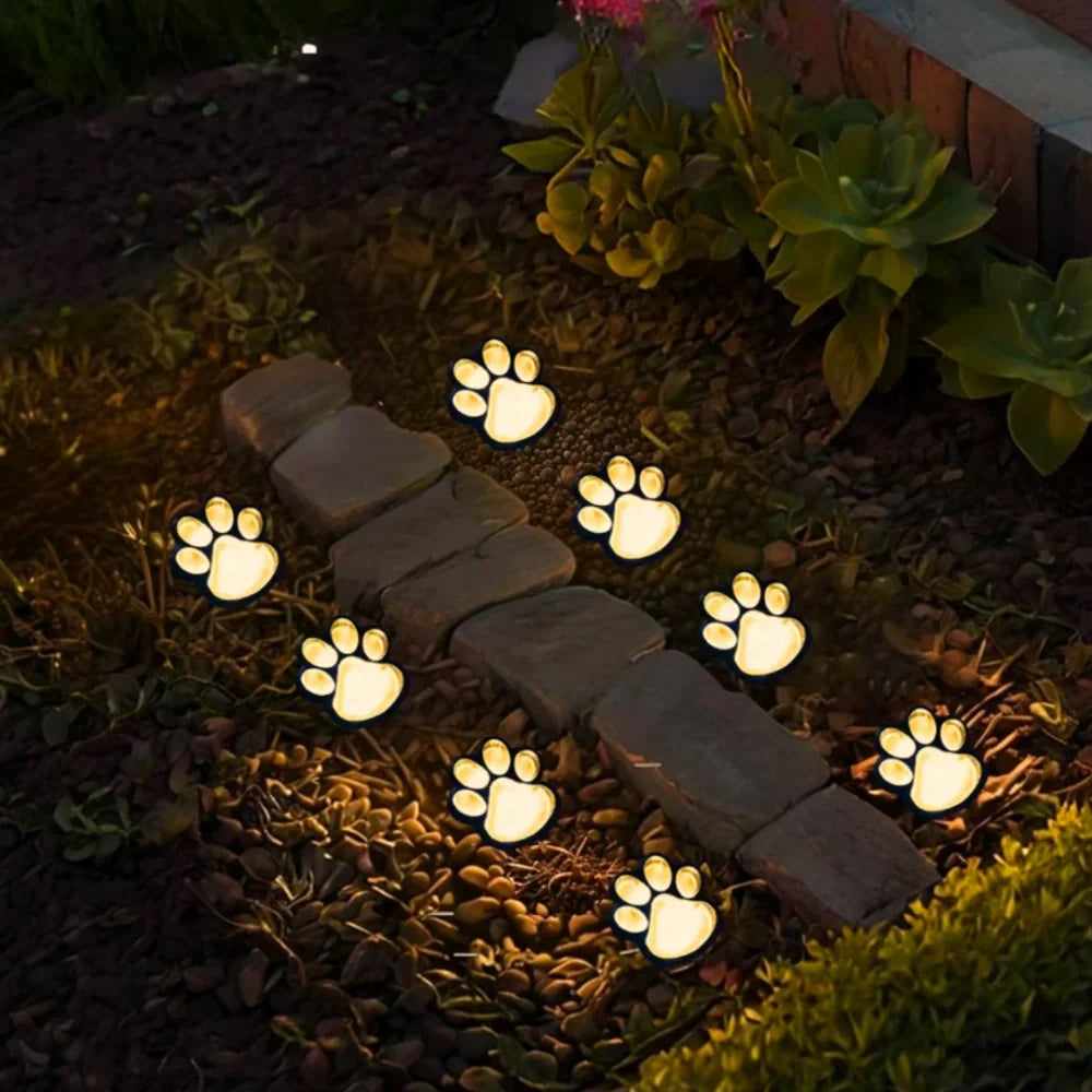 Decorative paw print solar lights, whimsical outdoor path lighting for gardens & yards. Waterproof LED.
