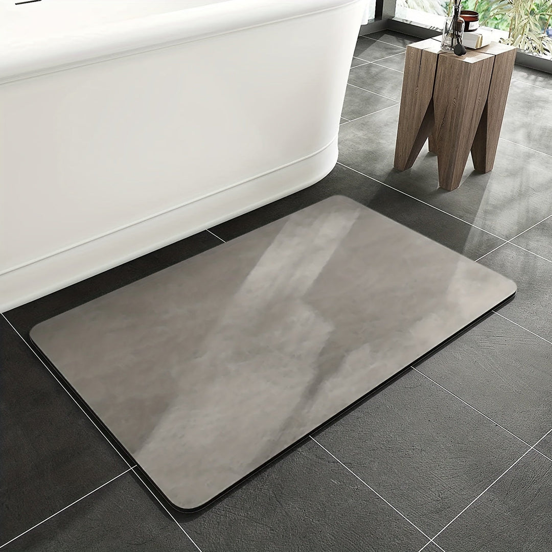 Gray quick-dry non-slip diatomaceous earth bath mat for enhanced bathroom safety & absorbent floor.