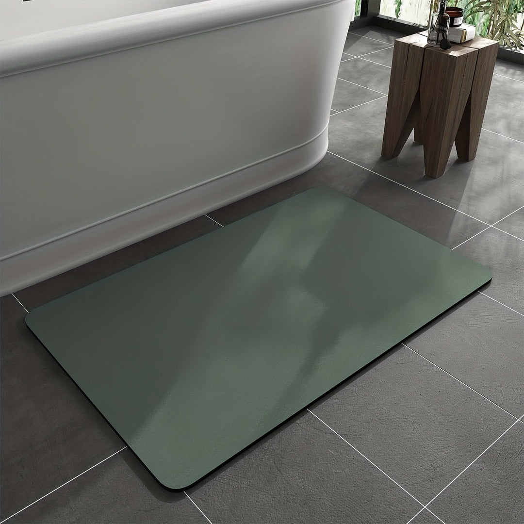 Absorbent diatomaceous earth bath mat, quick-dry & non-slip, ensuring bathroom safety and a clean floor.