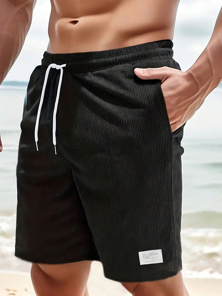 Comfortable men's casual shorts with adjustable drawstring, great for relaxed fit & summer days.