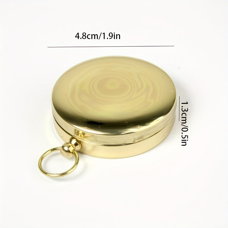 Clear dial of a waterproof copper survival compass, with glow-in-the-dark features for precise navigation.