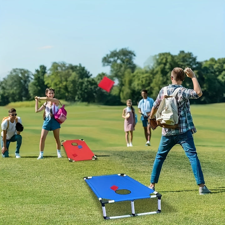 Kids & adults enjoying a portable cornhole game in a sunny park, perfect outdoor entertainment for leisure & travel.