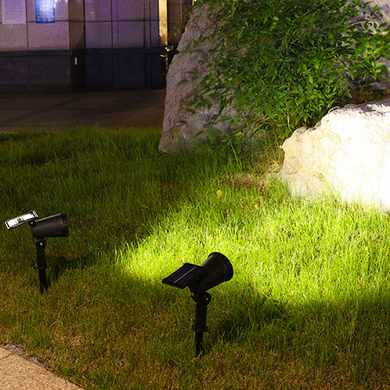 Solar garden accent light illuminating plants with vibrant RGB or classic white colors.