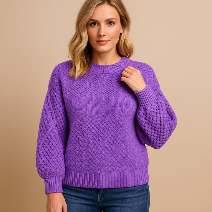 Versatile women's cable-knit sweater, relaxed fit. Stylish pullover, great for casual wear or dressing up this season.