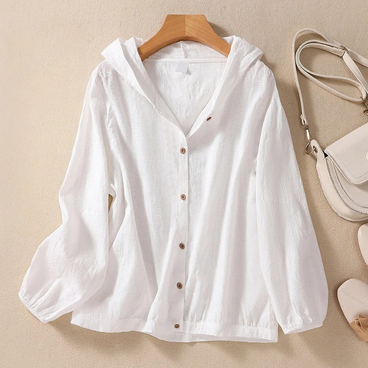 Women's relaxed hooded shirt for effortless everyday comfort. Chic long sleeve casual top.