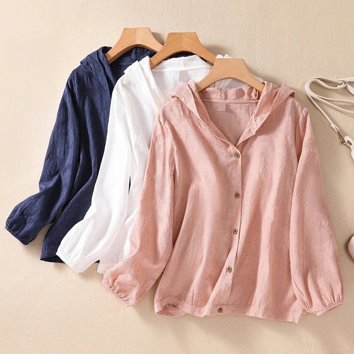 Relaxed fit women's hooded shirt, a comfortable and stylish long sleeve top for everyday wear.