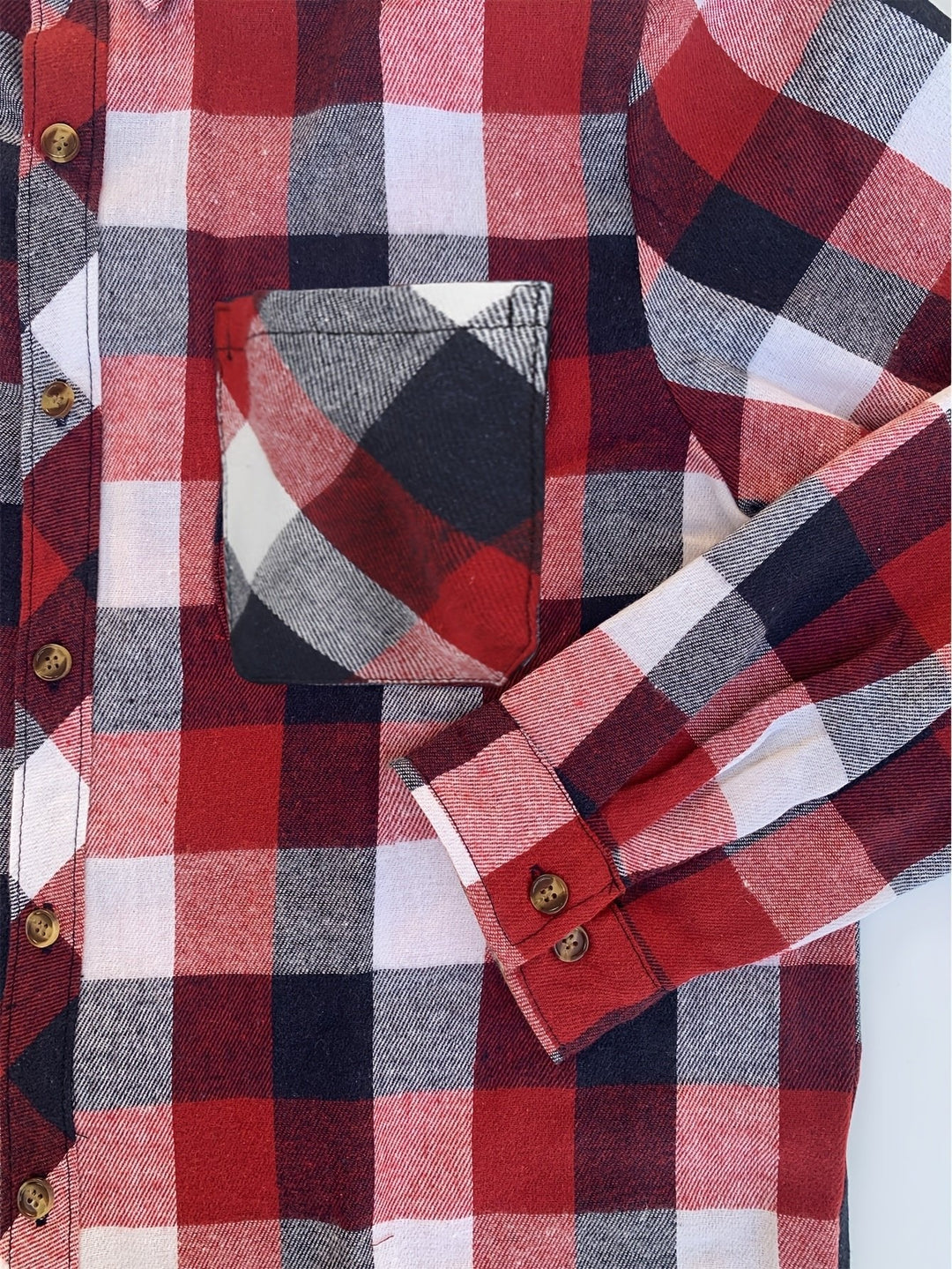 Relaxed fit women's plaid shirt with classic buffalo check pattern, button-up design.