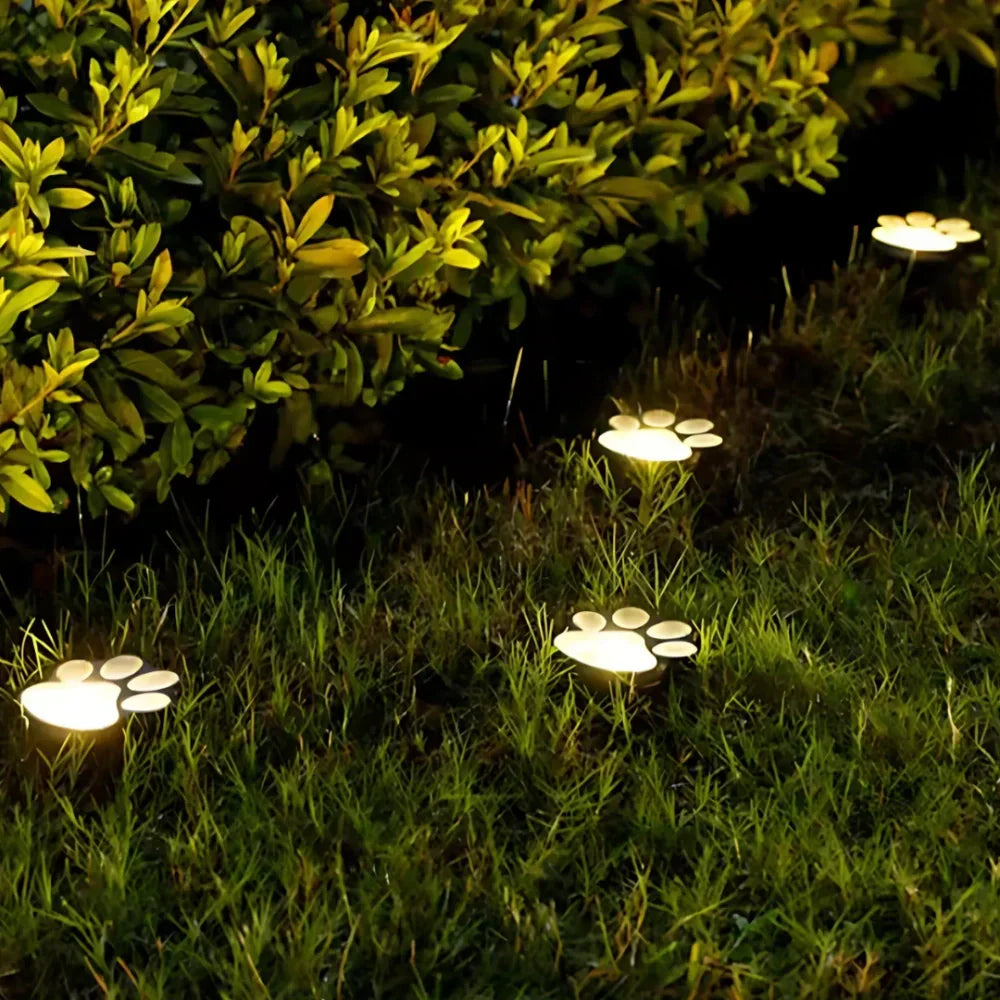 Set of waterproof paw print solar path lights, automatic LED for beautiful outdoor garden & yard decor.