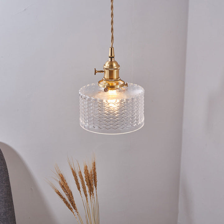 Elegant brass switch on a ribbed glass retro pendant lamp, available in clear or green, a stunning ceiling fixture.