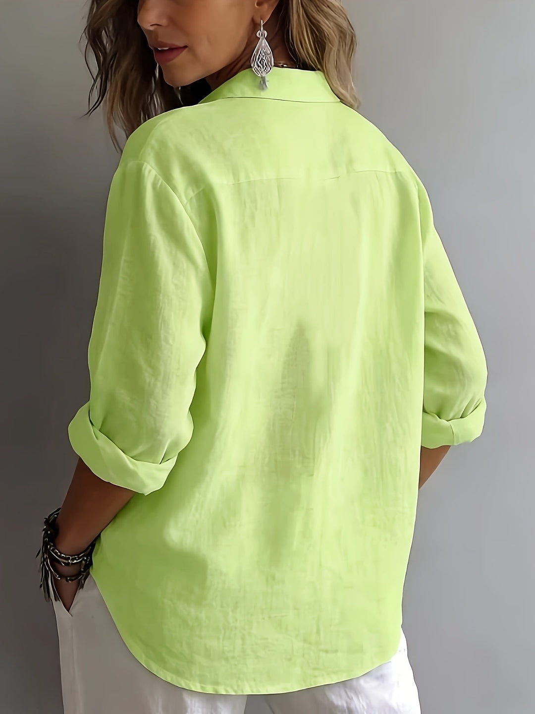 Professional women's workwear blouse. Elegant relaxed fit collared shirt, long sleeve for office.