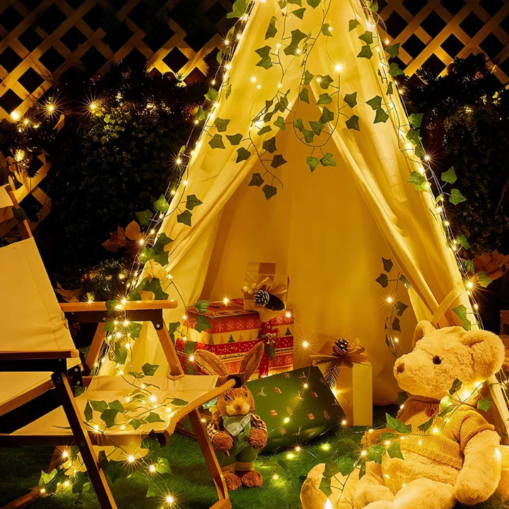 Warm white LED leaf vine string lights for cozy indoor/outdoor ambiance & decor.