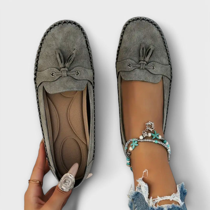 Side view of a women's orthopedic slip-on loafer, featuring soft cushioning for everyday comfort and effortless style.