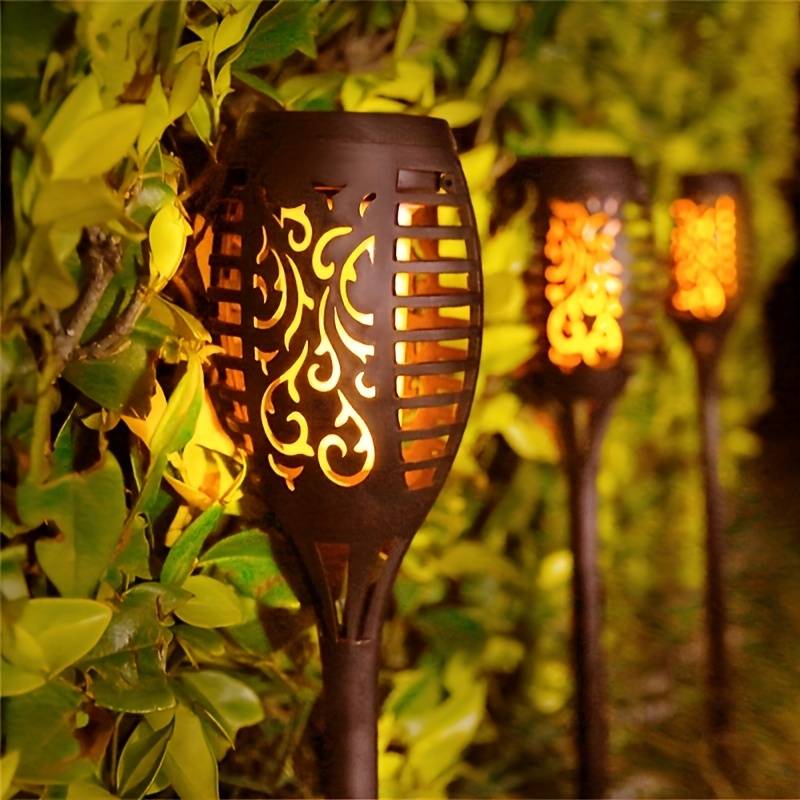 Garden solar torch light with a realistic flickering flame, ideal for creating a warm outdoor ambiance.