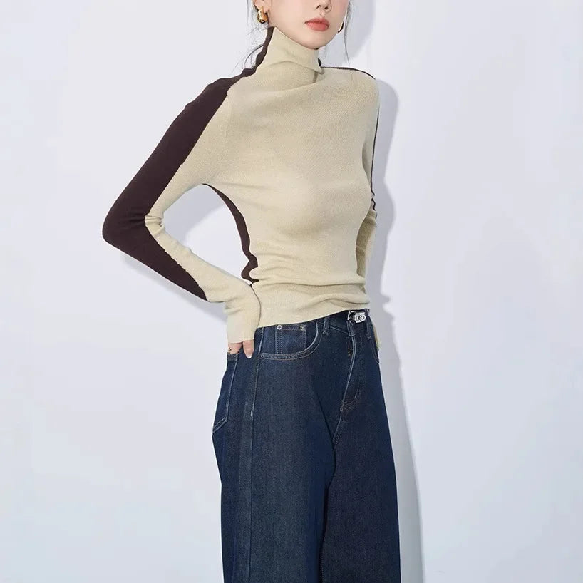 Stylish women's mock neck top with asymmetric contrast long sleeves, ideal for everyday elegant winter wear.
